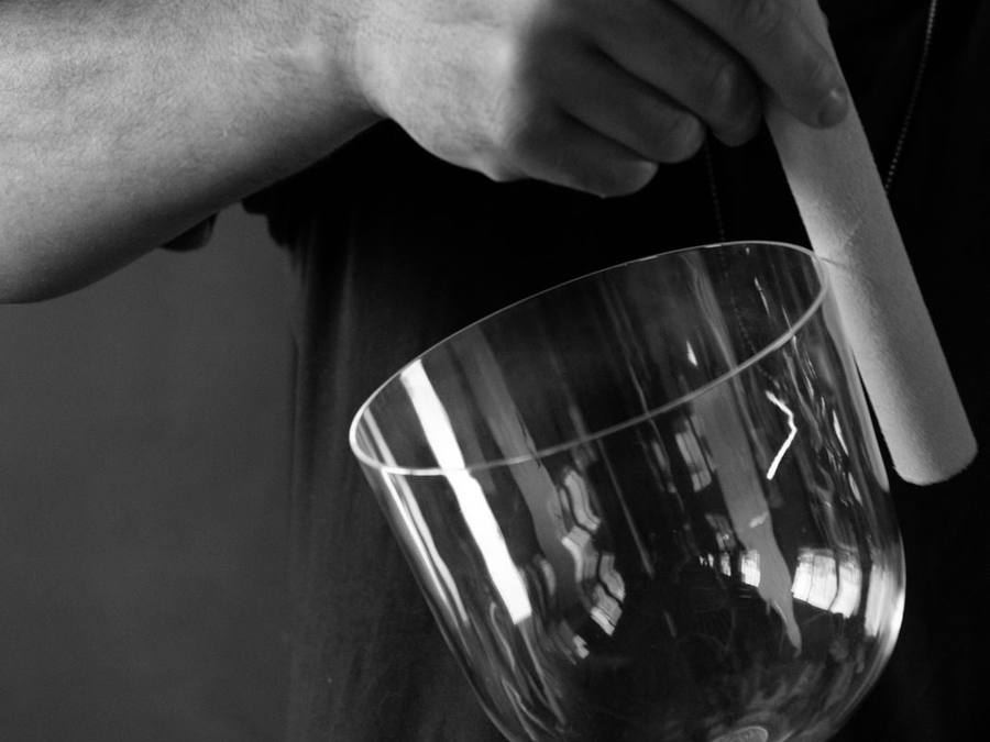 Close up of Tarik playing a crystal bowl