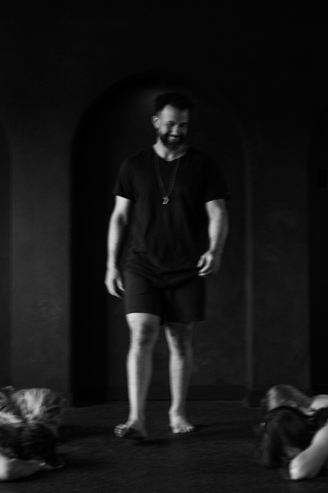 Tarik Hassan walking among participants during a live State Shift breathwork session