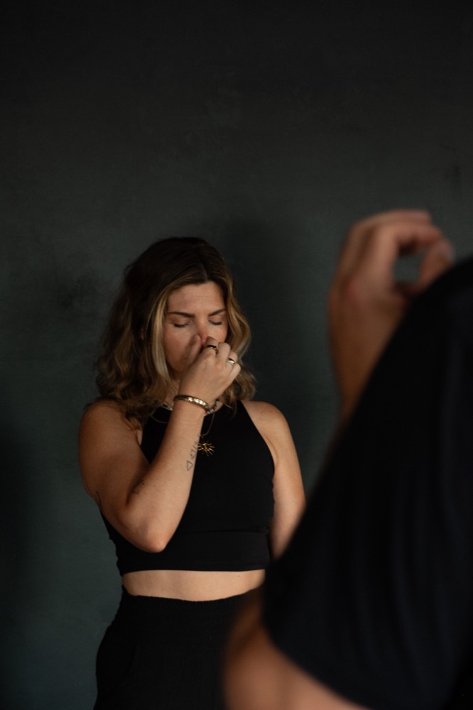 Close-up of a participant practicing alternate-nostril breathing during a State Shift workshop