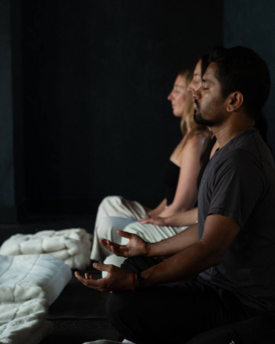A team member seated in a guided breathing practice