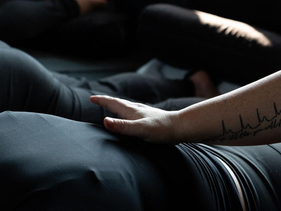 A member resting on a bolster during a session