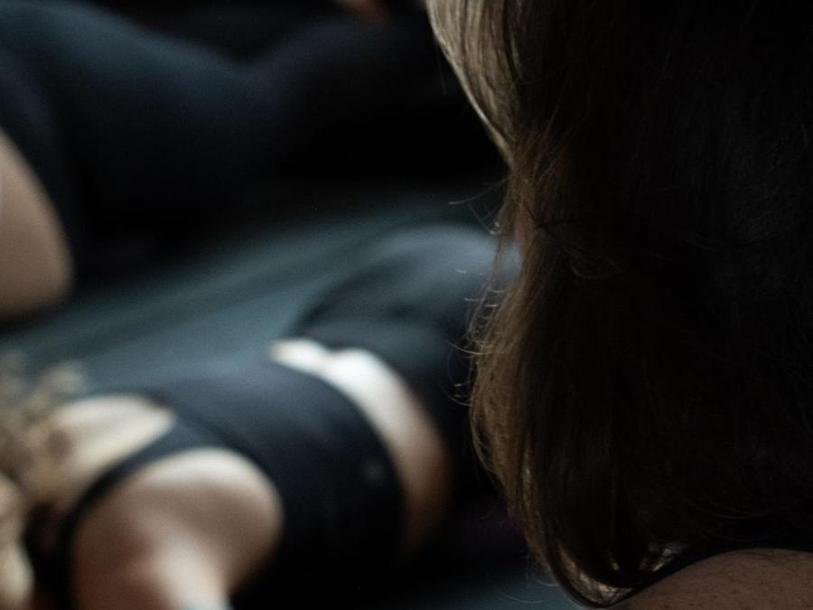 A member lying back in a guided practice