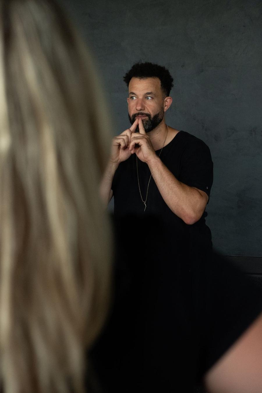 Tarik demonstrating a breathing technique