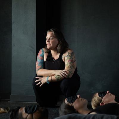 Susan Benoit adjusting a participant's posture during a State Shift facilitator training